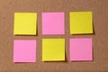 Six reminder sticky notes on cork board Royalty Free Stock Photo