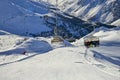 Six-seat ÃÂhairlift lifts mountain skier family on hill in Tyrol Alps