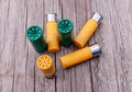 Six shotgun shells, four yellow and two green ones