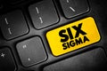 Six Sigma - set of techniques and tools for process improvement, text concept button on keyboard for presentations and