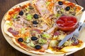 Six slices of pizza with different toppings on wooden board Royalty Free Stock Photo