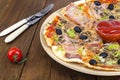 Six slices of pizza with different toppings on wooden board Royalty Free Stock Photo