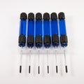Six small blue screwdrivers Royalty Free Stock Photo