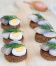 Six small canapes with herring