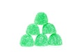 Six spearmint gumdrops forming a pyramid on white background Royalty Free Stock Photo