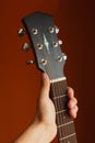 six-string acoustic guitar on a red background Royalty Free Stock Photo