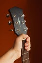 six-string acoustic guitar on a red background Royalty Free Stock Photo