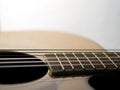 Six - string acoustic guitar on a white background. Royalty Free Stock Photo