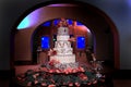 Six tiered wedding cake topped with orchids