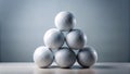 Six white volleyballs arranged in a pyramid shape on a light-colored surface against a muted backdrop. Generative AI Royalty Free Stock Photo