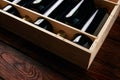 Six wine bottles collection in wooden box on wood table background Royalty Free Stock Photo