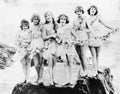 Six women posing at the beach