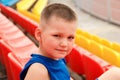 six-year-old boy is a football player at a sports stadium. face close. Children and sport