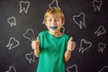 Six-year old boy shows myofunctional trainer. Helps equalize the growing teeth and correct bite, develop mouth breathing Royalty Free Stock Photo