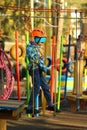 Six year old boy surmounting obstacle course in the rope park Royalty Free Stock Photo