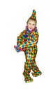 Six year old funny cute dancing boy in the clown suit. Without wig und makeup. , on white background Royalty Free Stock Photo