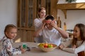 Horizontal portrait of a cheerful european family who spends time together at home in the kitchen Royalty Free Stock Photo