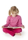 Six Year Old Girl Reading a Book Royalty Free Stock Photo