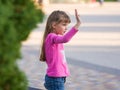 Six-year-old girl waving his hand