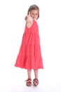 Six year old happy school girl success hand sign Royalty Free Stock Photo