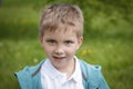 Six years old boy portrait over green Royalty Free Stock Photo