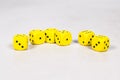 Six Yellow Dice on Clean Clear White Gray Grey Background Lined Randomly Royalty Free Stock Photo