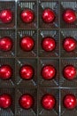 Sixteen of chocolates in red foil Royalty Free Stock Photo