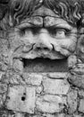 Sixteenth century era statue of a man with open mouth and curly hair