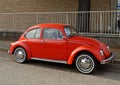 Sixties red model of the famous vintage car Type 1, better known as beetle. Royalty Free Stock Photo