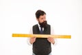 Size table concept. Learning metric system. School teacher. Size really matters. Man bearded hipster holding ruler Royalty Free Stock Photo