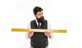 Size table concept. Learning metric system. School teacher. Size really matters. Man bearded hipster holding ruler