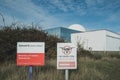 Sizewell, Suffolk, UK - Circa October 2022: No Drone warning signs seen at the perimeter of a modern nuclear power plant on the Su