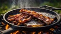 Bacon and Beef Steak Sizzling on a Cast Iron Pan Over Open Fire Royalty Free Stock Photo