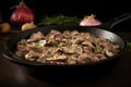 sizzling beef stroganoff in a black frying pan