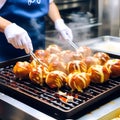 Sizzling Delights: Journey of Cooking Takoyaki - Japan\'s Most Popular and Delicious Snack Royalty Free Stock Photo