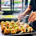 Sizzling Delights: Journey of Cooking Takoyaki - Japan\'s Most Popular and Delicious Snack Royalty Free Stock Photo