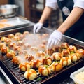 Sizzling Delights: Journey of Cooking Takoyaki - Japan\'s Most Popular and Delicious Snack Royalty Free Stock Photo