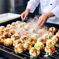 Sizzling Delights: Journey of Cooking Takoyaki - Japan\'s Most Popular and Delicious Snack Royalty Free Stock Photo