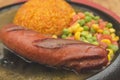 Sizzling Hungarian Sausage, served with mixed vegetables and java rice on a szzler platter with gravy