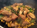 Sizzling Jerk Chicken cooking in a frying pan