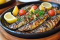 A sizzling platter of caballa al horno with baked mackerel. Royalty Free Stock Photo