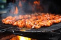 sizzling shrimp on hot grill with smoke around