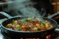 A sizzling skillet of bubble and squeak with braised rabbit. Royalty Free Stock Photo