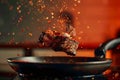 Sizzling steak leaps from pan, a culinary airborne spectacle