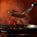 Sizzling steak leaps from pan, a culinary airborne spectacle