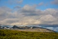 Skaftafell national park mountains and cumulus clouds, Iceland i