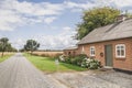 Skals, Denmark, July 2021: Beautiful farmhouse near the field