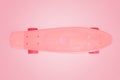 Skate board on pink background with copy space