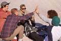 Skate park, high five and relax with friends, support and bonding together with happiness and conversation. Outdoor Royalty Free Stock Photo