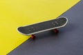 Skateboard finger on a gray-yellow background Royalty Free Stock Photo